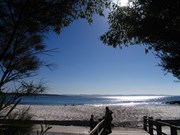 Bridge over creek with Jervis Bay beyond 