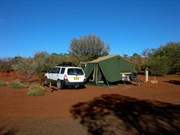 Yulara camping on red dirt & hot in the sun
