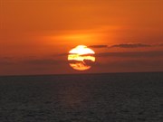 Look for a green flash as top edge of sun sets