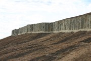 Man-made walls atop wave rock used to harvest rain water to da