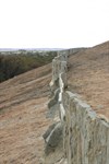 Close up view of the man-made walls atop wave rock