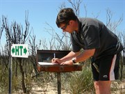 Andrew signing the visitors book