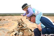 Putting a stone atop the cairn