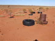Old fuel dump showing rusty 44 gallon drums and some old tyres