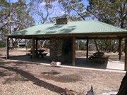 The Shelter. Both sides have fireplace. 1 side has and oven.