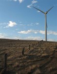 An old fence line leads to a new turbine on Starfish Hill