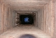 Peering down the restored well 49 - CSR
