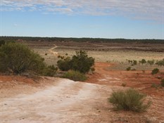 A steep jump-down to the lake bed.