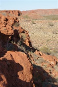 Rocky Ramparts emerging from the sand.