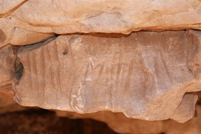 Grooves left by the sharpening of spears (and Michael Tobins initials) - Well 38 CSR