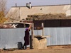 A Spritely Lady Collecting Water from the Well
