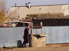 A Spritely Lady Collecting Water from the Well