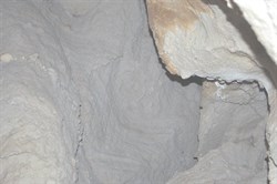 Inside a deep cave, looking up
