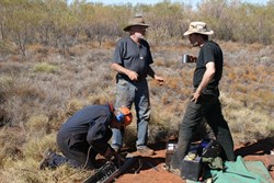 John working while the supervisors supervise (and drink tea!)
