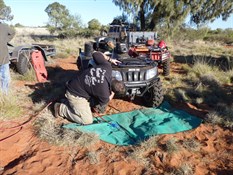 Clearing out spinifex and plant material from the quad radiator
