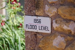 Flood Level Sign on Old Stone Shed