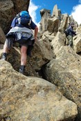 climbing higher on Cradle Mountain over big boulders