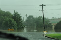 The swollen Bega river blocks the Highway