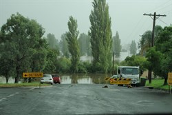the swollen river at Bega and detour signs