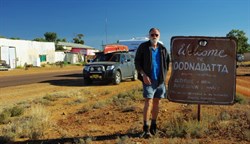 John with a sign at Oodnadatta