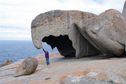 Fiona holding the rock up with 1 arm