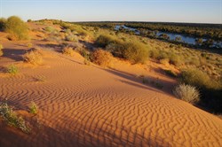 The setting sun changing the colours of the dunes