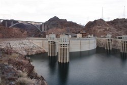 View over back of Hoover Dam, bridge in background