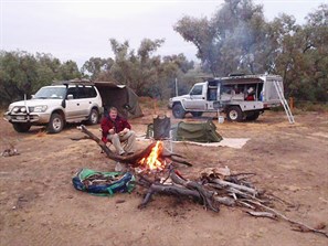 Enjoying the fire during a momentary lull in the rain - Cooper Creek