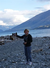 Vik by the shores of Lake Wanaka with traveller (Note glass of red)