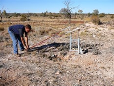 Small water bore with hand pump.