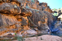 at the end of the gorge....red rocks, water and sandy beach