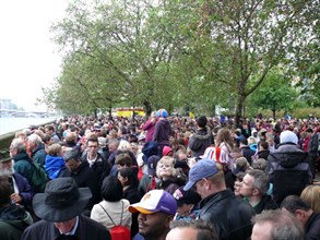 Part of the crowd lining the Thames