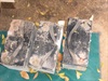 three dead batteries sitting on the floor