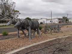 Sculpture pulling 3 furrow plough